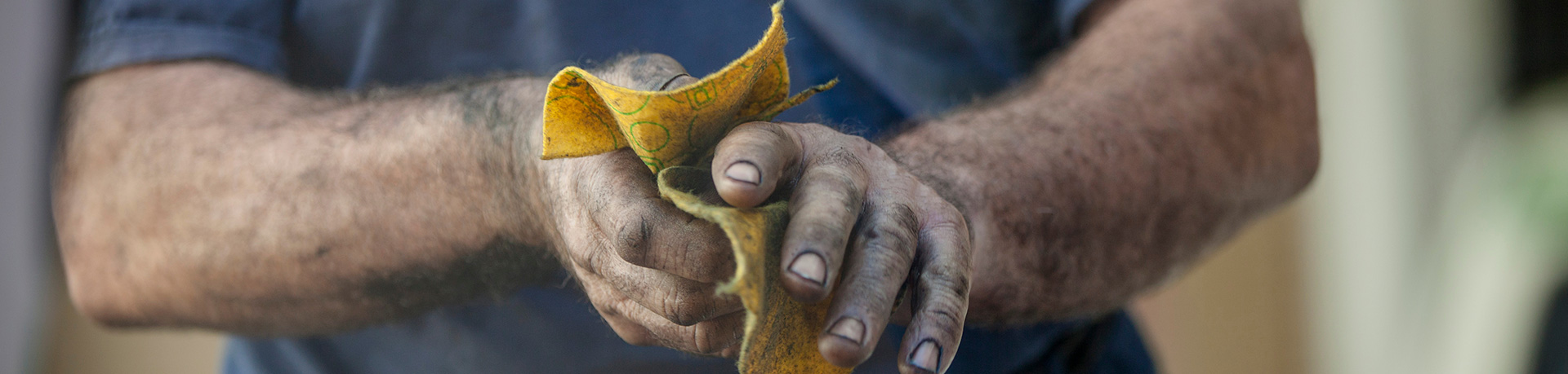 Man cleaning oily hands
